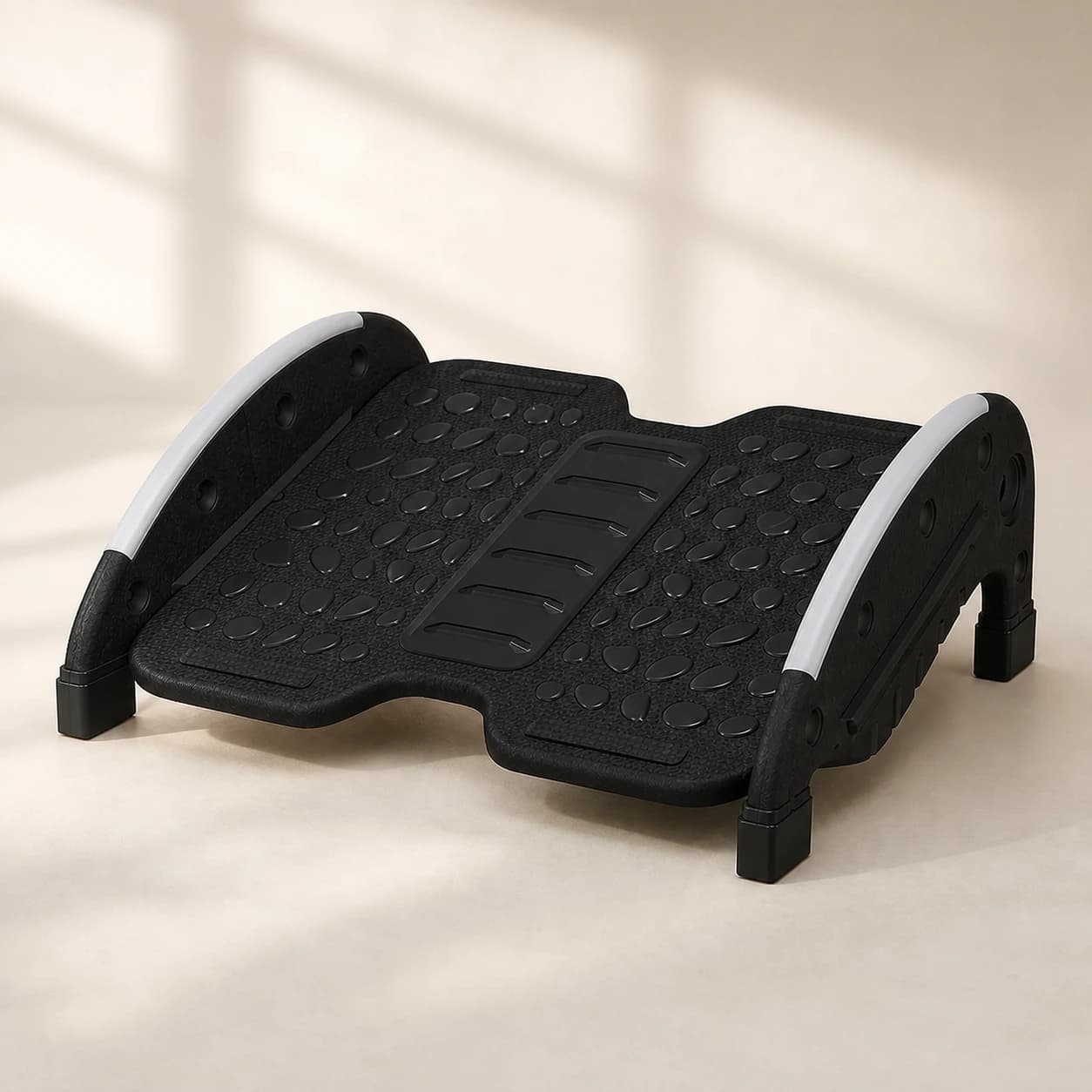 Black FlexRock Duo footrest on a warm neutral studio background