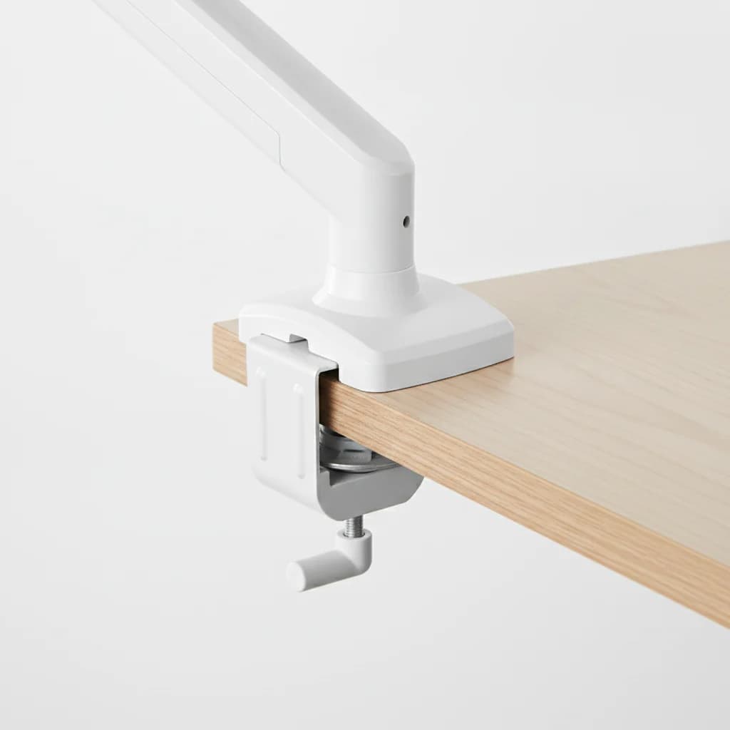 Close-up of the monitor arm gas-spring joint and clamp