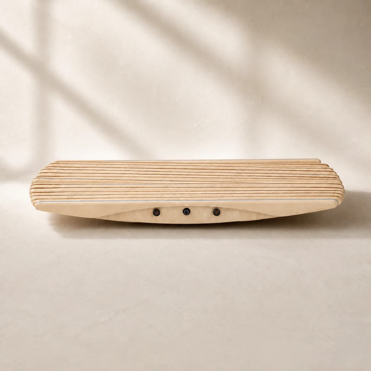 ErgoSway natural wooden balance board on a light studio background