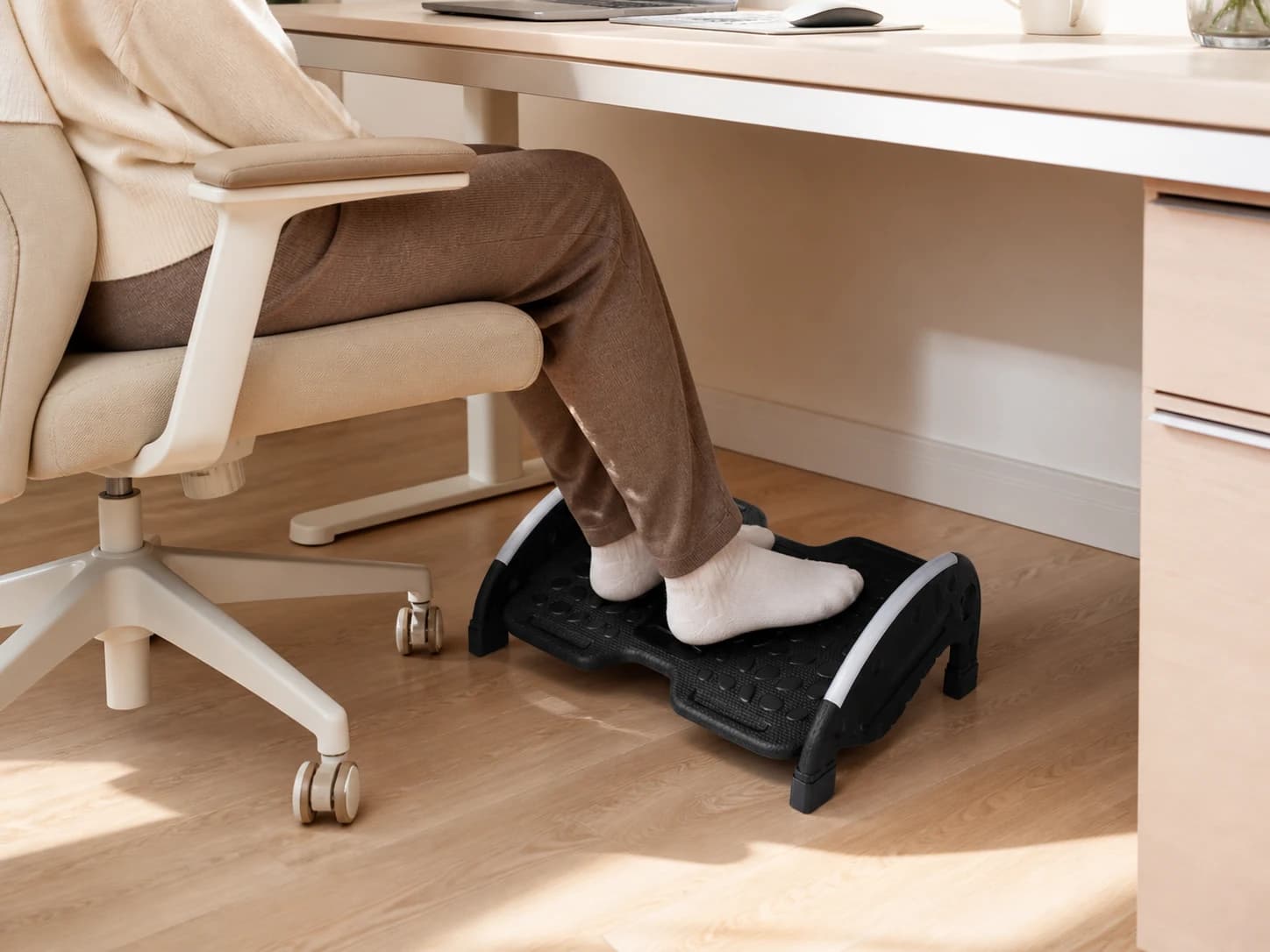 Seated person using FlexRock Duo beneath a home-office desk