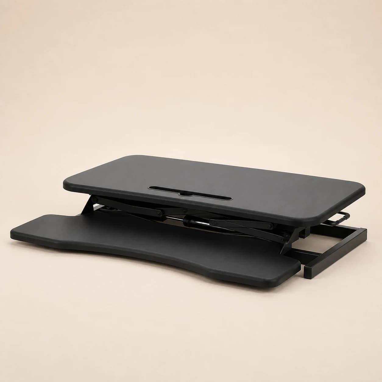 Lowered black SwiftLift riser showing its upper platform, keyboard tray, frame, and base