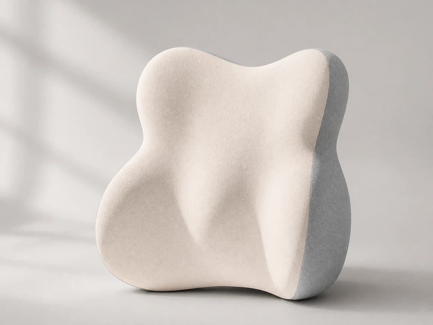 Front studio view of the taller four-lobed DriveNest lumbar cushion