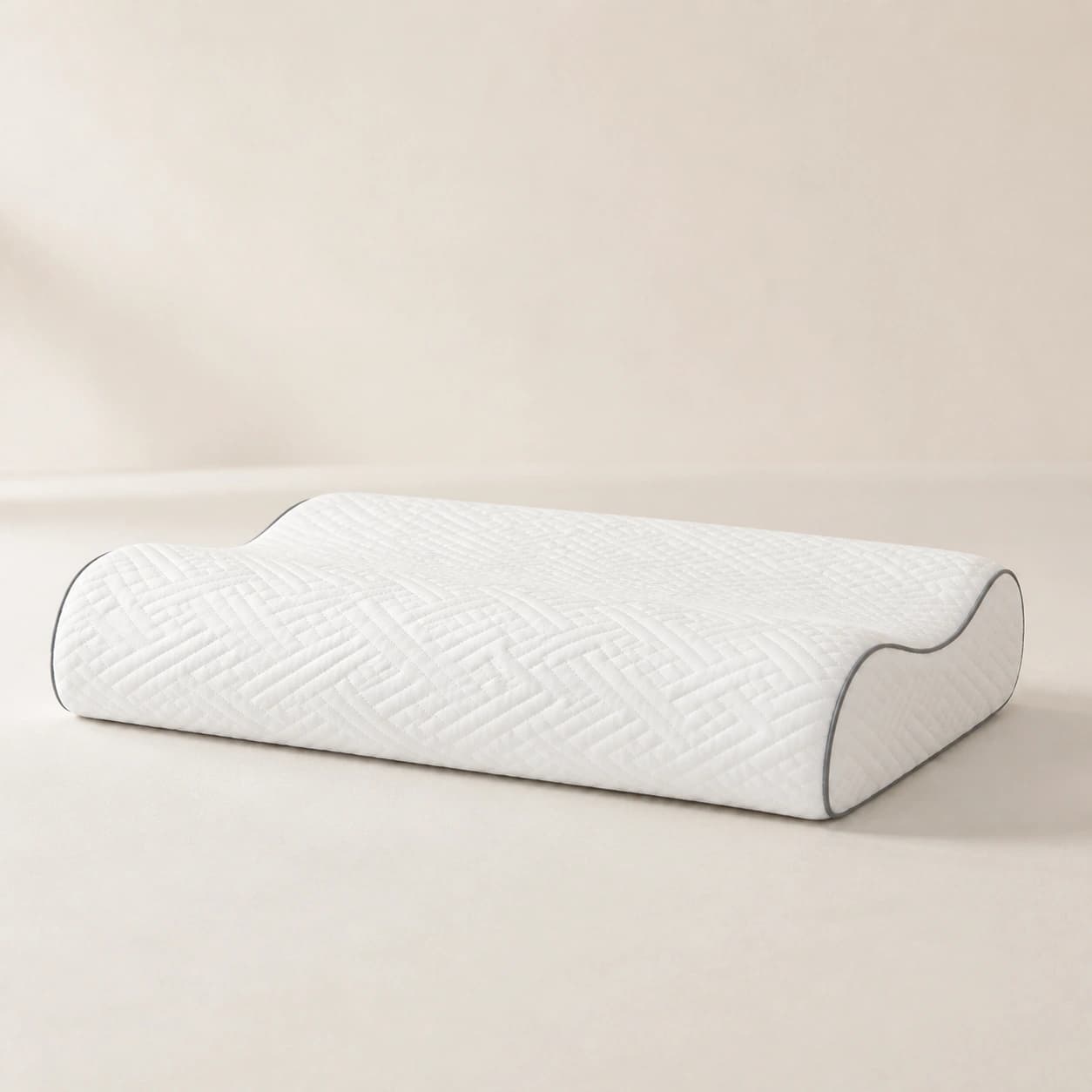 Side studio view of the WaveRest low model's restrained 9 cm roll, shallow trough, and 7 cm roll