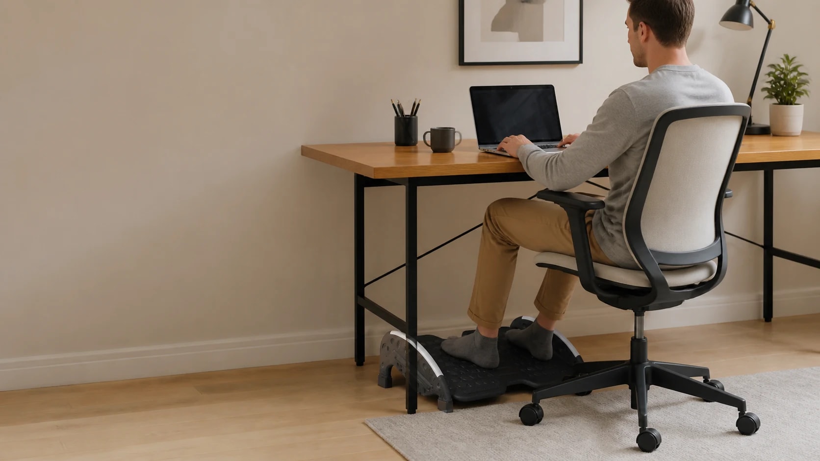 FlexRock Duo positioned beneath a desk while a person works in an office chair