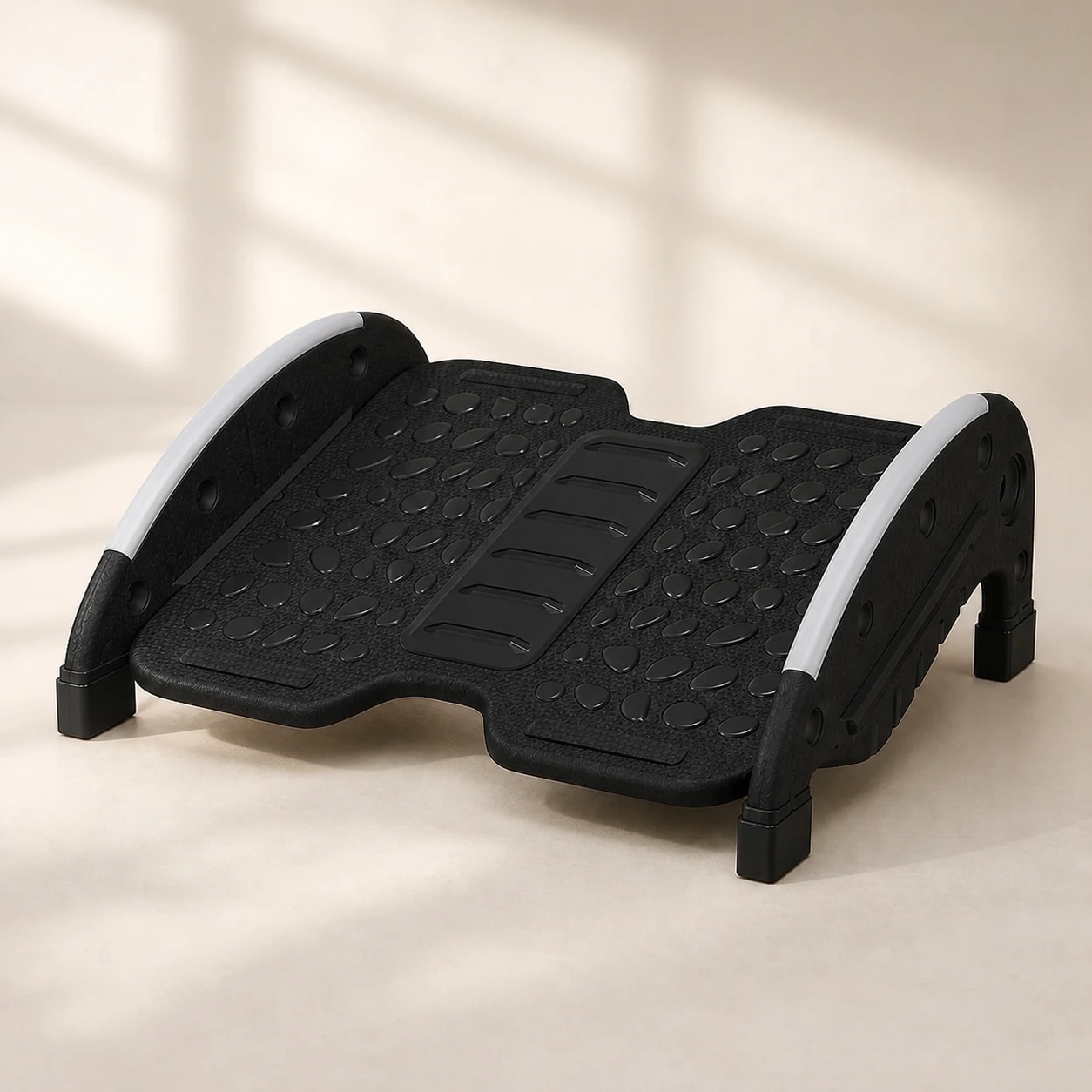 FlexRock Duo black two-mode footrest on a warm light studio background