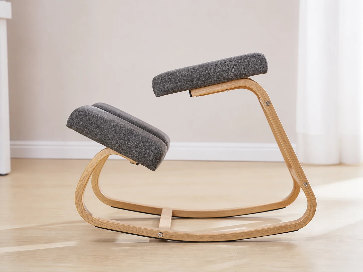 Side view showing the KneelArc Chair's continuous curved rocker rails
