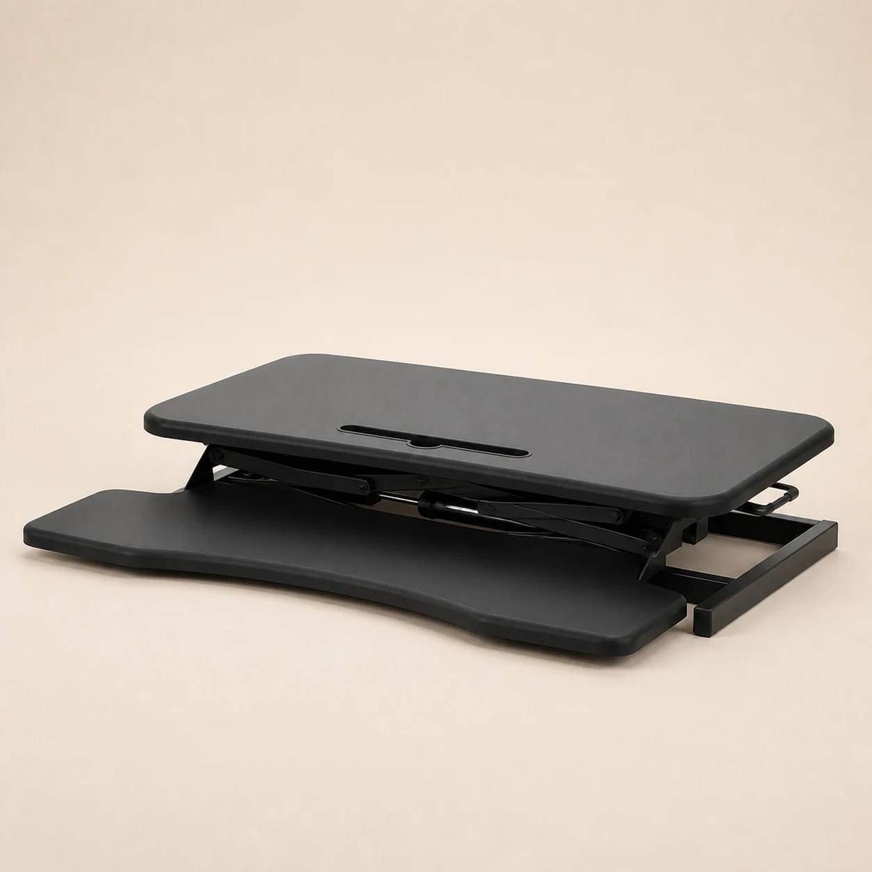 Lowered black SwiftLift riser showing its upper platform, keyboard tray, frame, and base