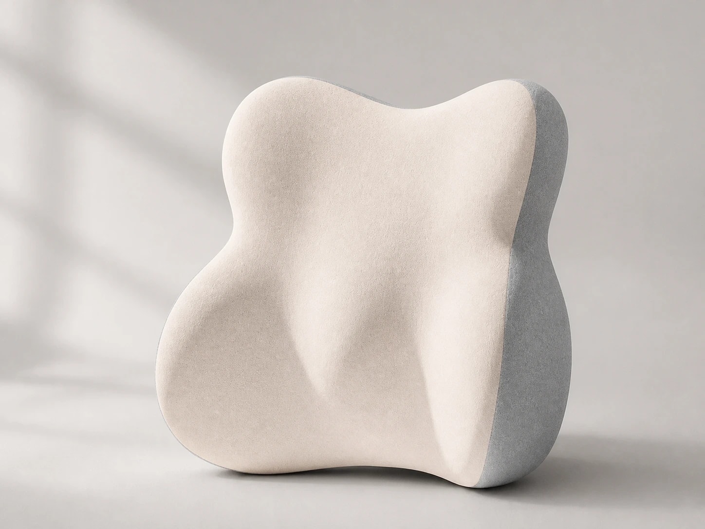 Front studio view of the taller four-lobed DriveNest lumbar cushion