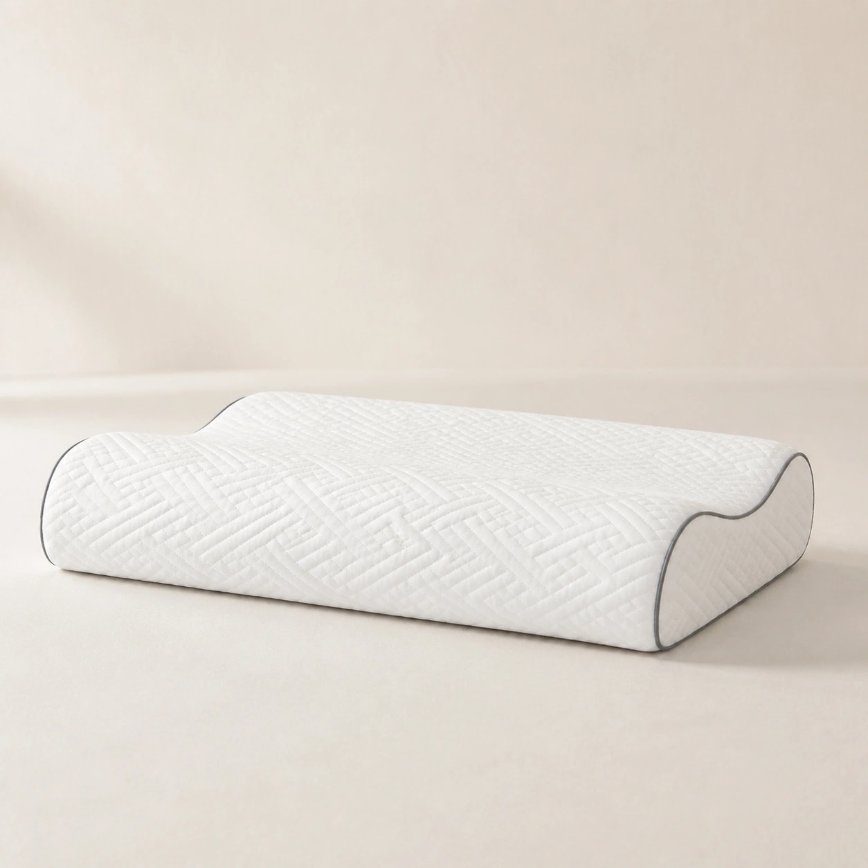 Side studio view of the WaveRest low model's restrained 9 cm roll, shallow trough, and 7 cm roll