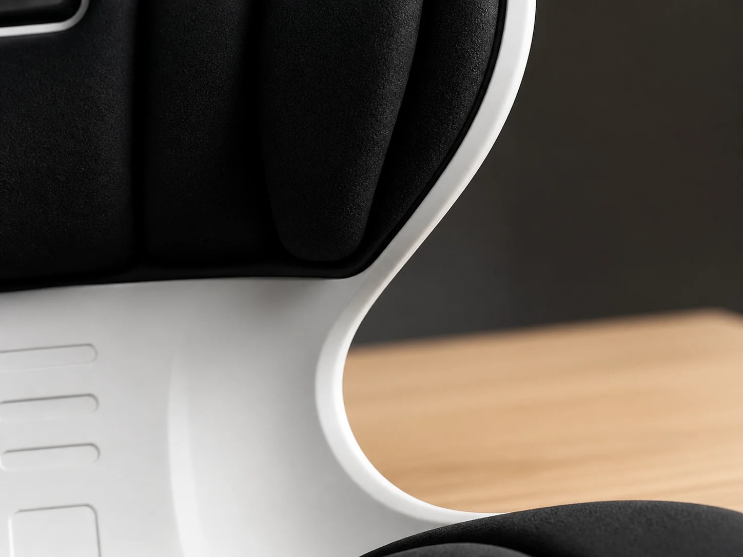 Macro view of a black PostureShell contact zone meeting its white outer perimeter