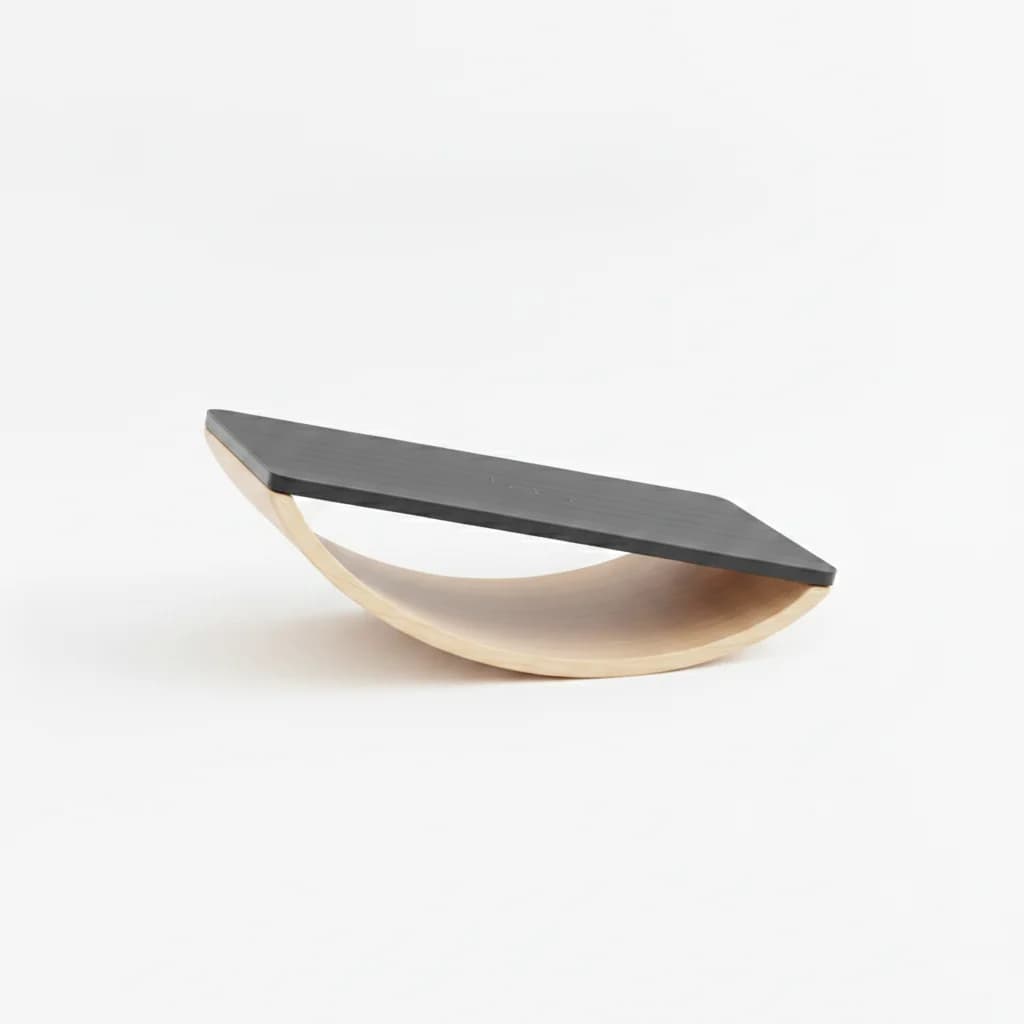 Balance board tilted to one side on its curved base