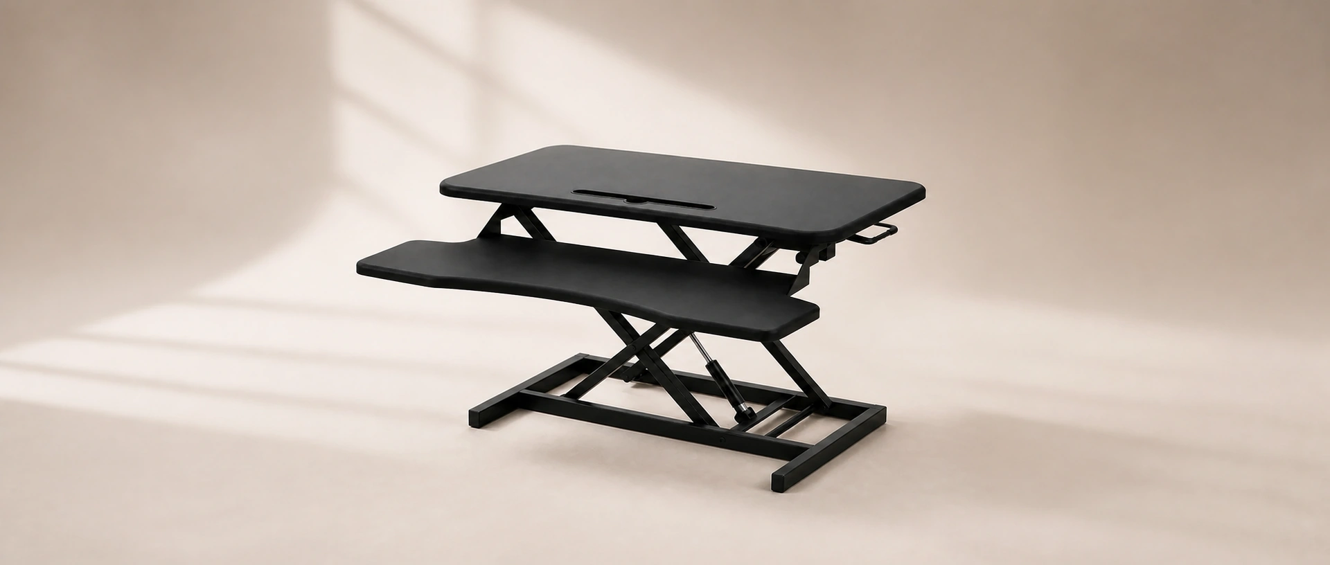 SwiftLift Desk Riser showing its two-tier work surface and crossed lift frame